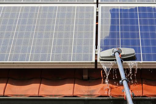 Solar panel cleaning with squeegee