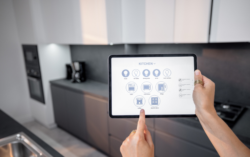 Person controlling smart appliances via tablet